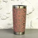 Custom engraved YETI tumbler with leopard print pattern on a pink cup, exposing the silver metal underneath.