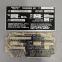 Laser engraved replacement trailer identification plate shown beside the damaged original plate.