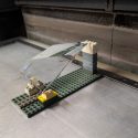 Custom laser engraved a crystal glass award on a LEGO base.